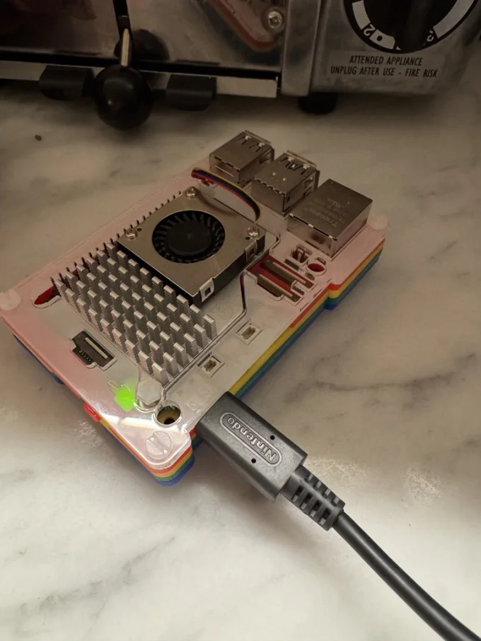 Raspberry Pi in rainbow case running the ledger server
